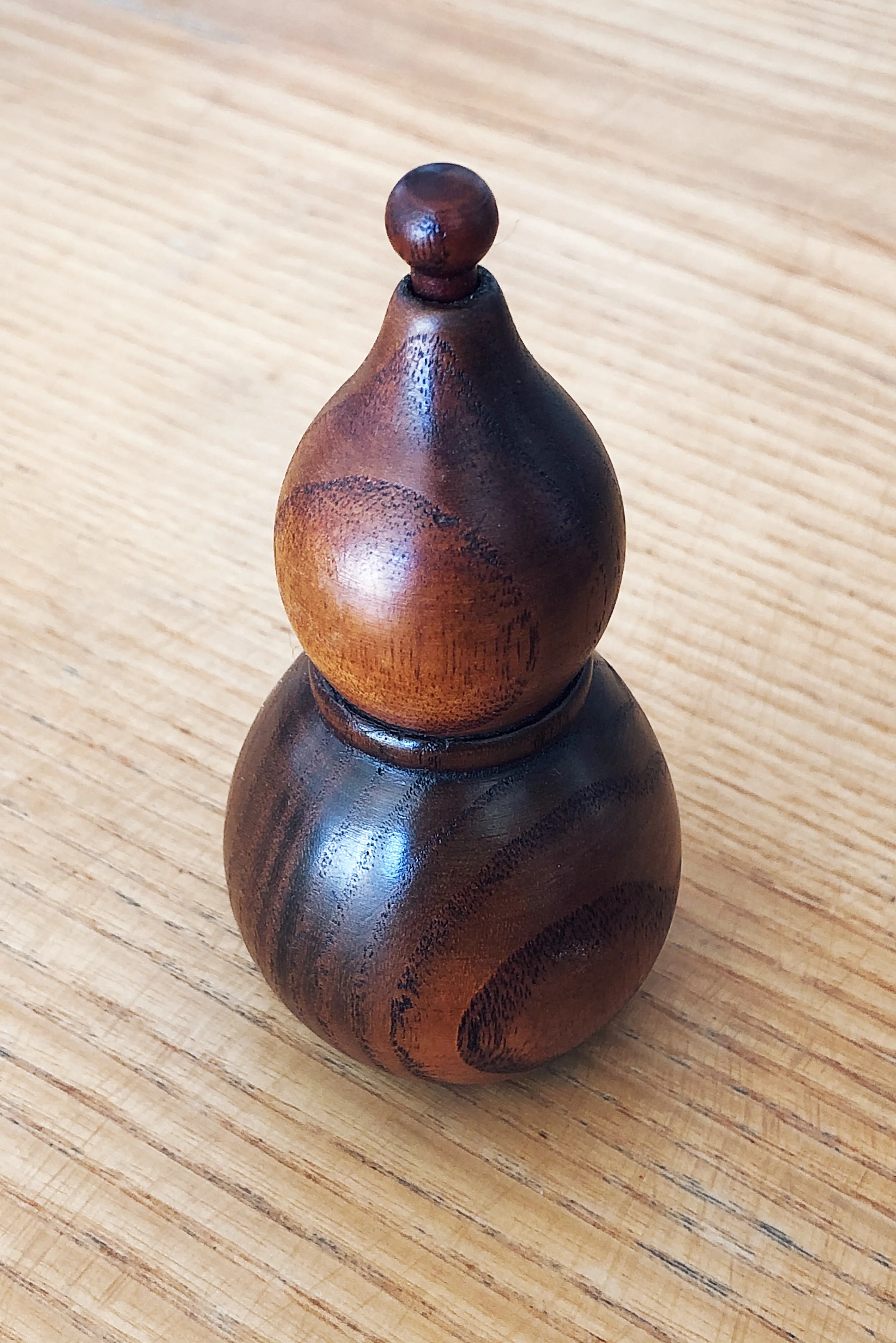 A wooden chili dispenser